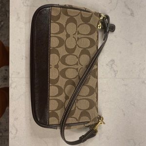 Coach monogram purse.  Small brown with leather accents.